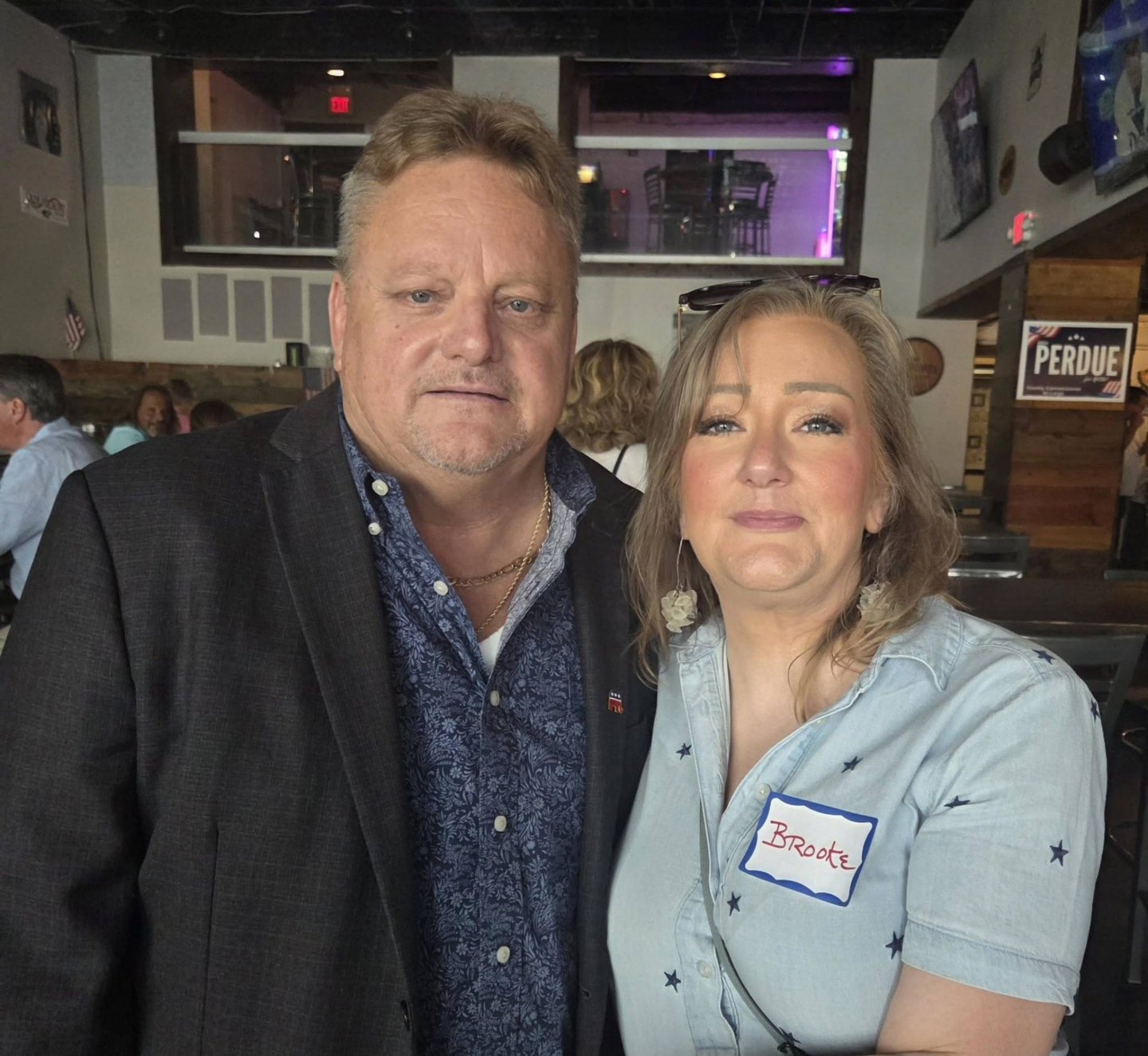 Mike Perdue with a supporter at a community event.